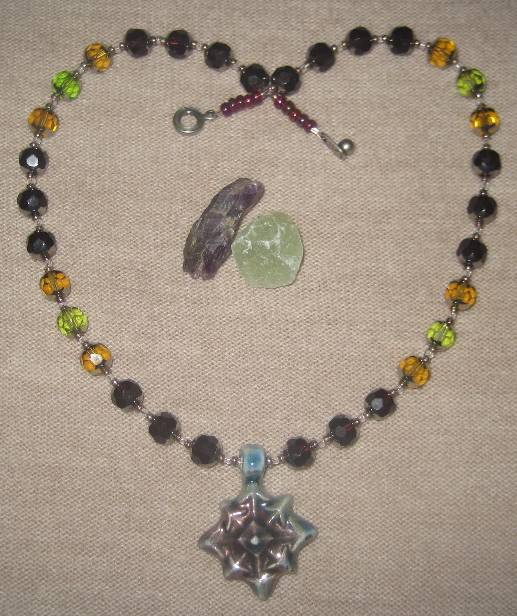 Copper Tones, Blue Raku Star and Wine-Toned Faceted Necklace Copper Tones, Blue Raku Star and Wine-Toned Faceted Necklace